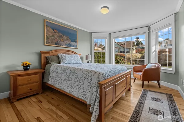 a living room with furniture and a book shelf