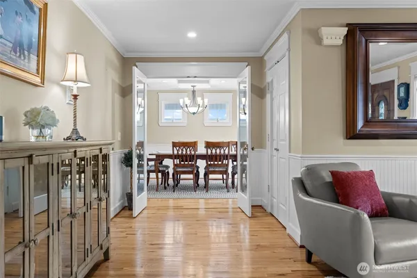 a view of a dining room with furniture window and wooden floor