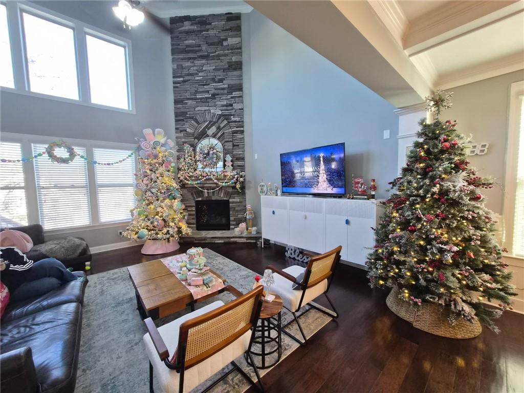 a living room filled with furniture and a christmas tree