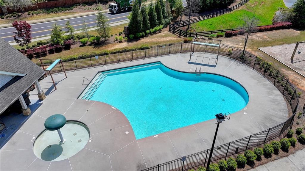 4071 Woodward Walk Lane Suwanee, GA 30024 - Photo 49 of 50 an aerial view of a house with a swimming pool
