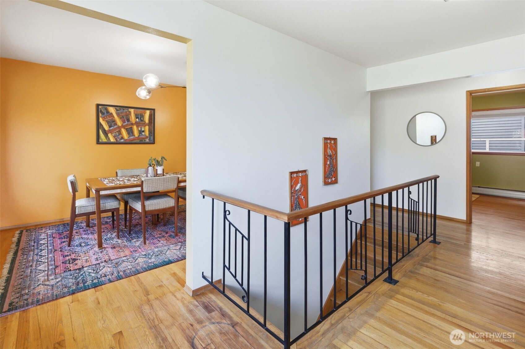 2803 South Walker Street Seattle, WA 98144 - Photo 21 of 40 a view of a hallway with wooden floor and a potted plant