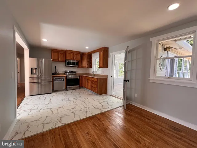 a view of kitchen with wooden floor