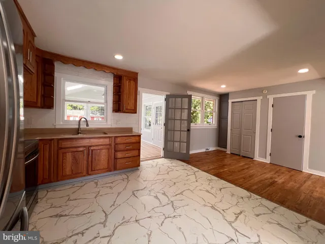 a large bedroom with a large bed and a large window