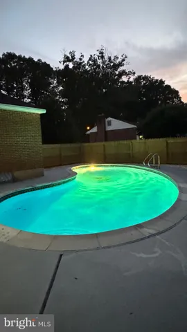 a view of a swimming pool and outdoor space