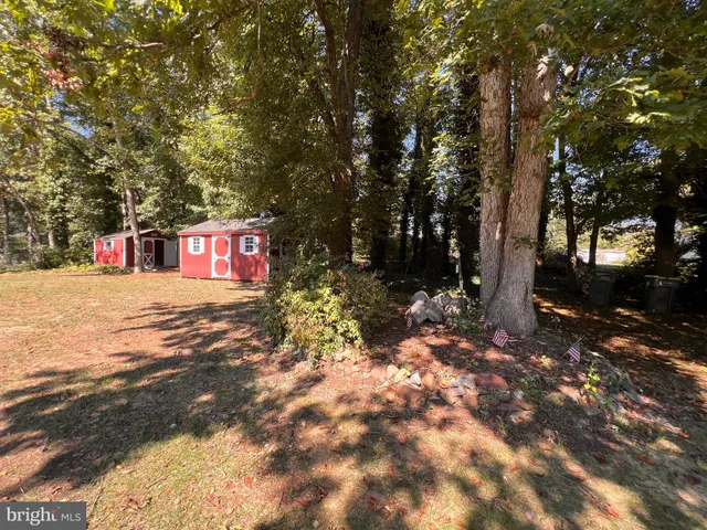 a view of a street with trees in the background
