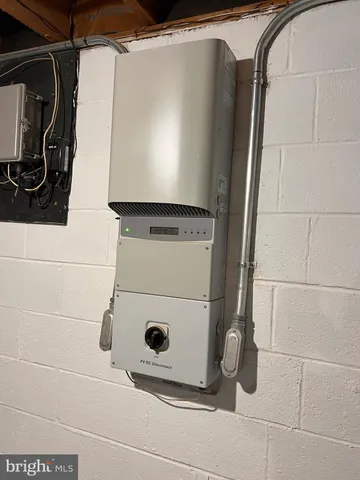 a utility room with a washing machine and cabinets