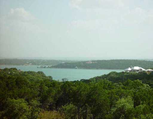 8324 Lime Creek Road Volente, TX 78641 - Photo 1 of 1 a view of a lake from a yard