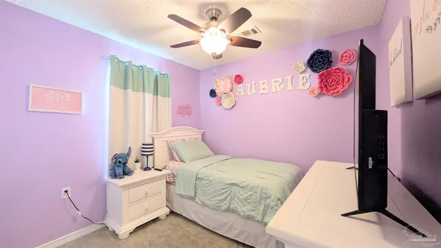 a bedroom with pink walls and pink walls