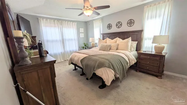 a bedroom with bed and window