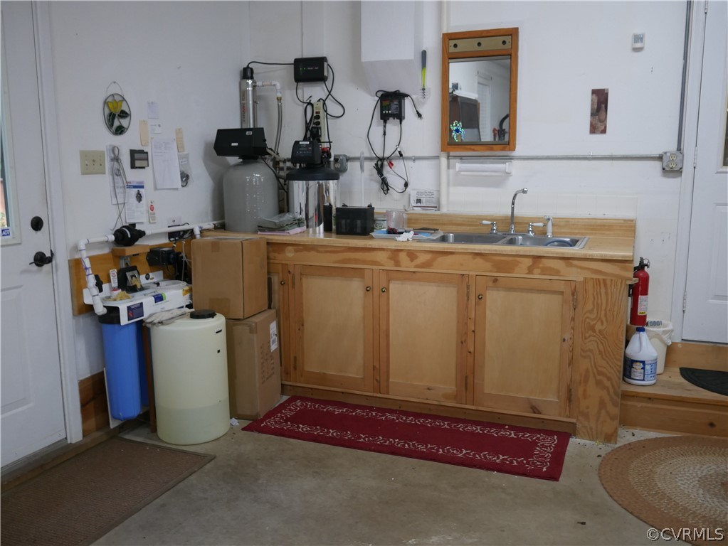 4656 East Grey Fox Gum Spring Gum Spring, VA 23065 - Photo 28 of 32 Work area in the garage and water softener