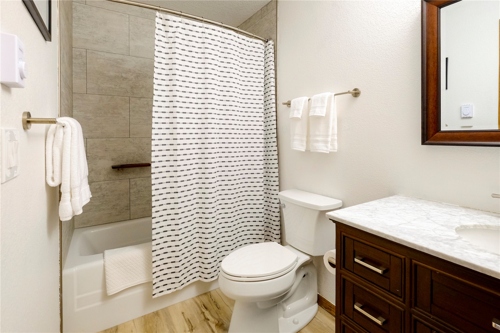 23034 Highway 6, Unit 305 Keystone, CO 80435 - Photo 14 of 27 a bathroom with a granite countertop toilet sink and mirror
