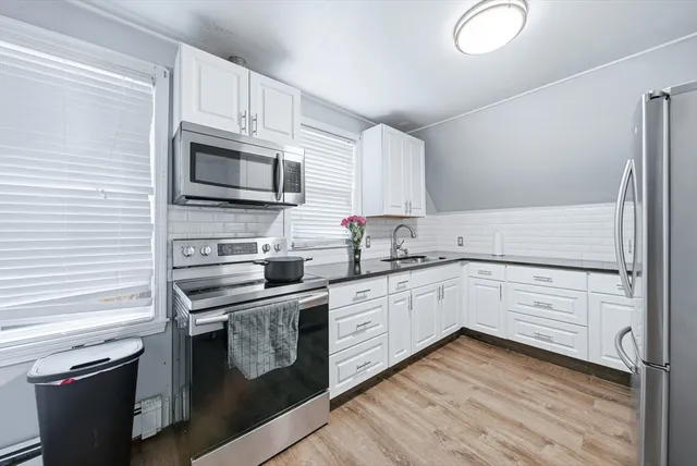 a view of a kitchen with a sink