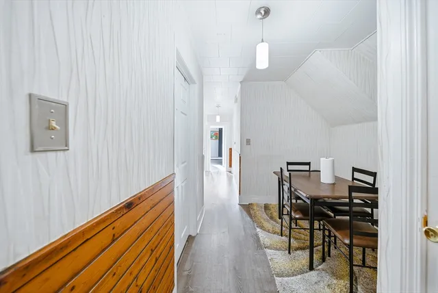 a bed room with a bed and a chair