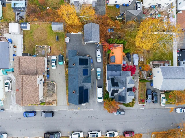 an aerial view of houses with yard