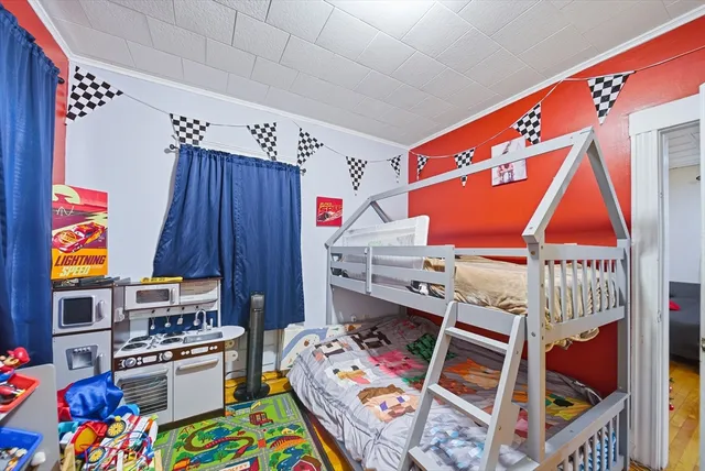 a room with furniture and a baby crib