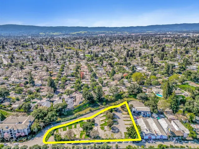 a view of a large pool and outdoor space