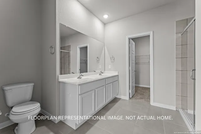 an empty room with windows and ceiling fan