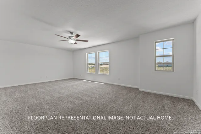 a spacious bedroom with a bed and a window