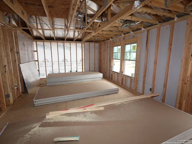 a view of a room with wooden walls