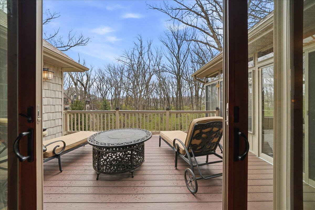 770 Quinlan Court Crown Point, IN 46307 - Photo 21 of 57 a view of balcony with wooden floor and outdoor seating