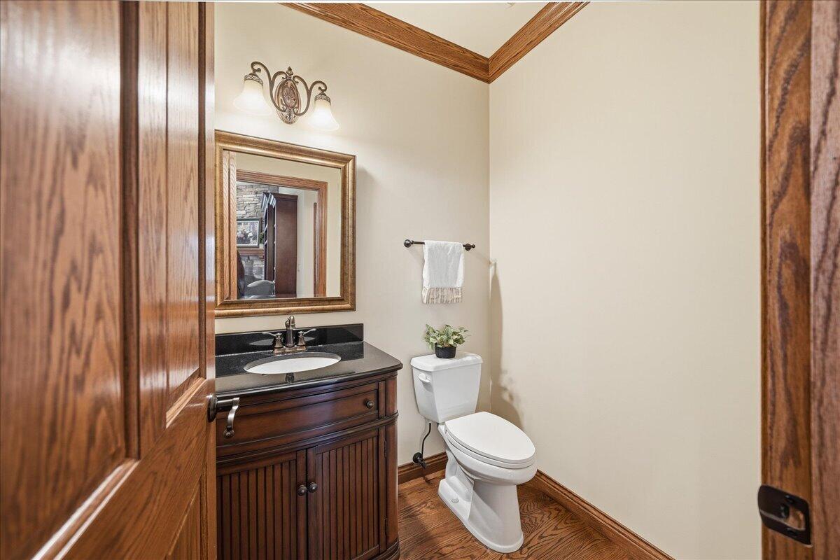 770 Quinlan Court Crown Point, IN 46307 - Photo 22 of 57 a bathroom with a granite countertop toilet sink and mirror