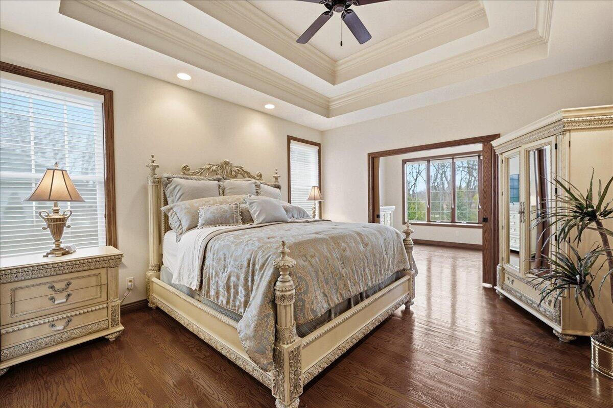 770 Quinlan Court Crown Point, IN 46307 - Photo 23 of 57 a bedroom with a large bed and a large window with the outer view