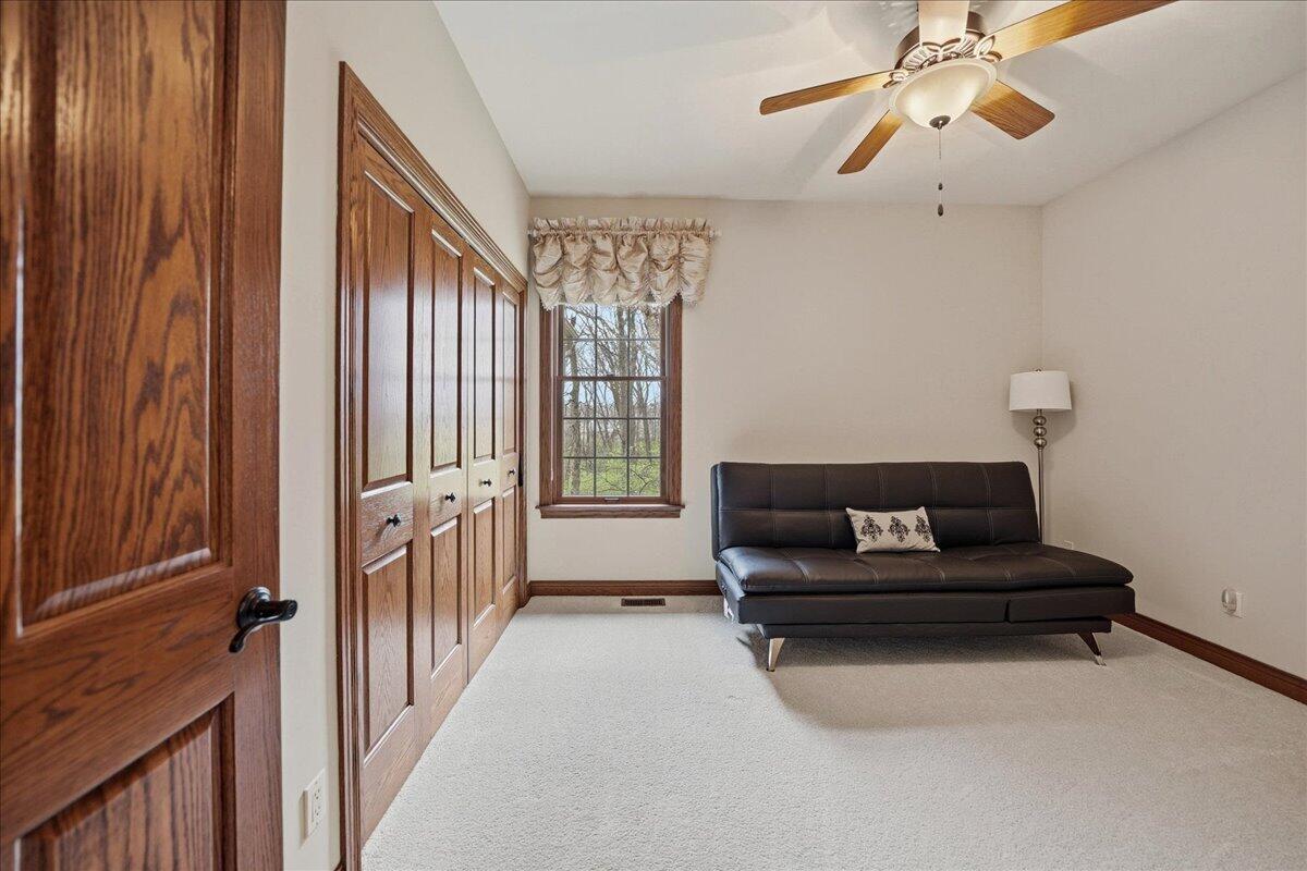 770 Quinlan Court Crown Point, IN 46307 - Photo 30 of 57 a living room with furniture and a chandelier