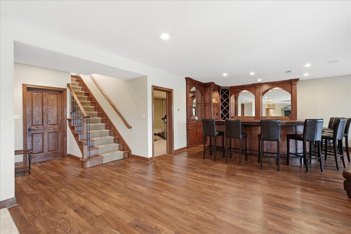 770 Quinlan Court Crown Point, IN 46307 - Photo 33 of 57 a view of a dining room with furniture and wooden floor