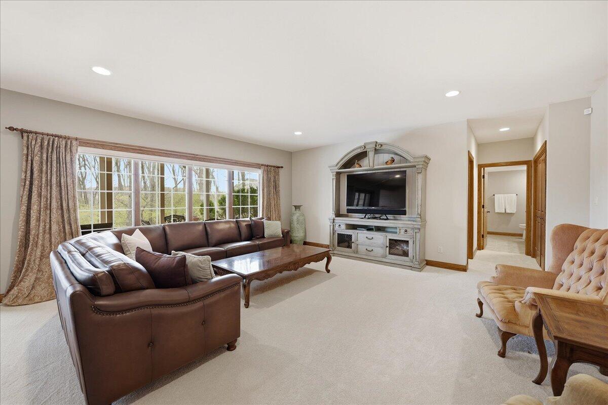 770 Quinlan Court Crown Point, IN 46307 - Photo 39 of 57 a living room with furniture and a flat screen tv