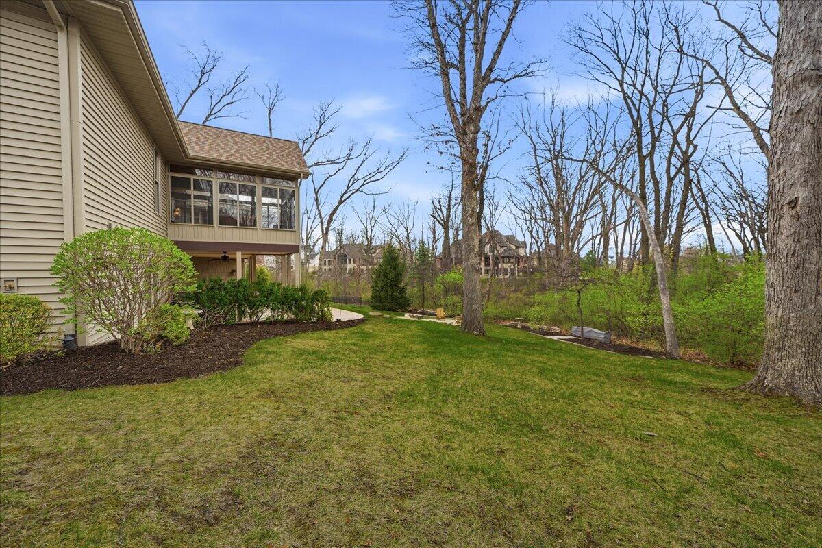 770 Quinlan Court Crown Point, IN 46307 - Photo 46 of 57 a view of a backyard with plants and trees