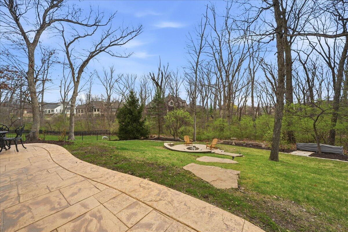 770 Quinlan Court Crown Point, IN 46307 - Photo 47 of 57 a backyard of apartments with large trees