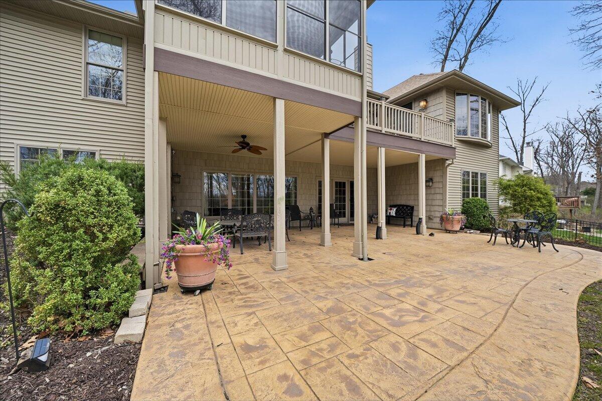770 Quinlan Court Crown Point, IN 46307 - Photo 48 of 57 a view of a building with sitting area and potted plants