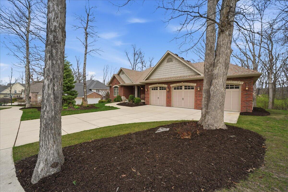 770 Quinlan Court Crown Point, IN 46307 - Photo 56 of 57 a view of a house with backyard and tree s