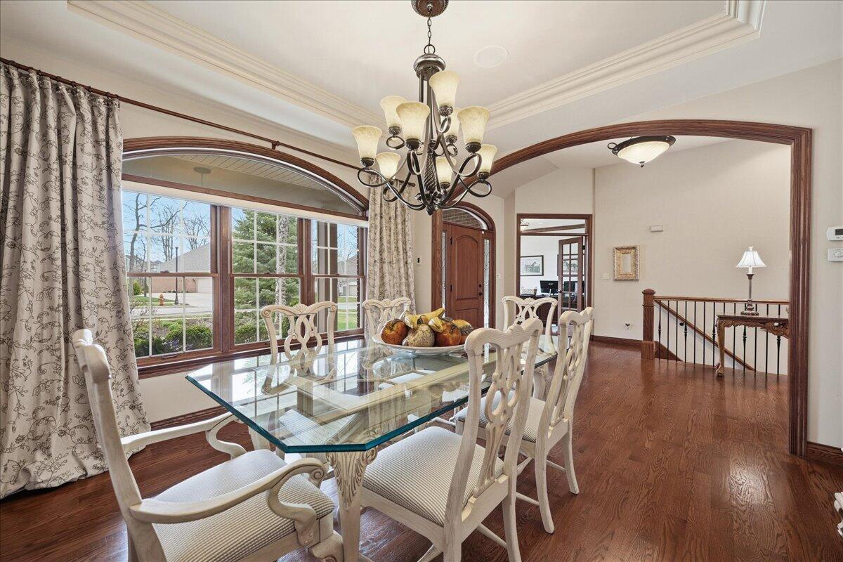 770 Quinlan Court Crown Point, IN 46307 - Photo 7 of 57 a view of a dining room with furniture window and wooden floor