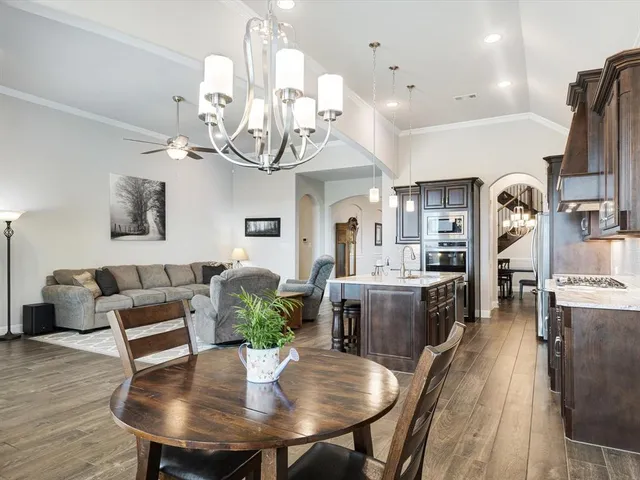 a view of a dining room with furniture and wooden floor
