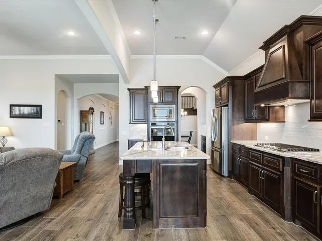 an aerial view of house with yard and lake view