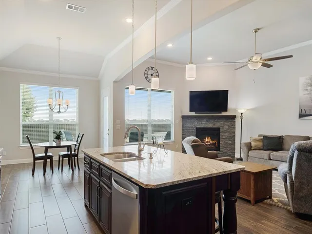 an aerial view of a house with garden space and street view