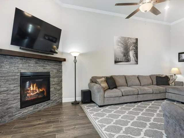 a view of a dining room with furniture wooden floor and chandelier