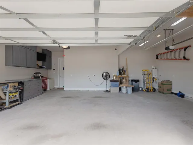 a living room with furniture and white walls