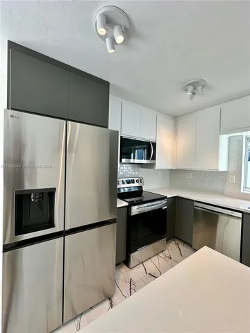 a utility room with washing machine