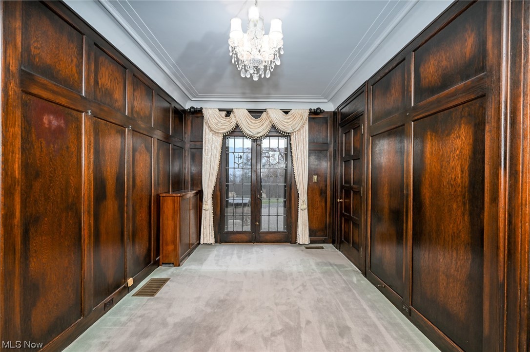 871 Merriman Road Akron, OH 44303 - Photo 11 of 35 Wainscoting wood panels flank the entryway