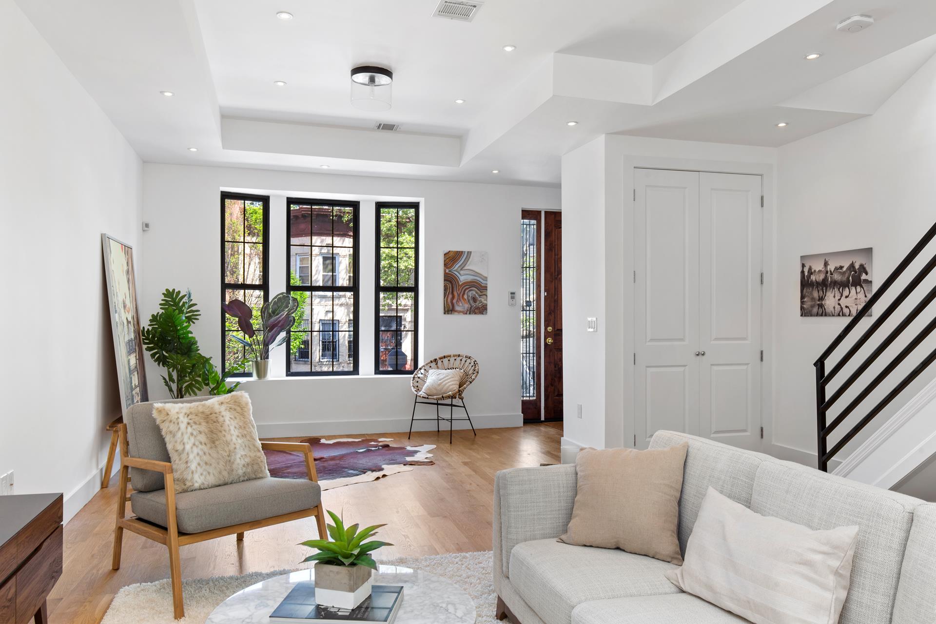 a living room with furniture and window