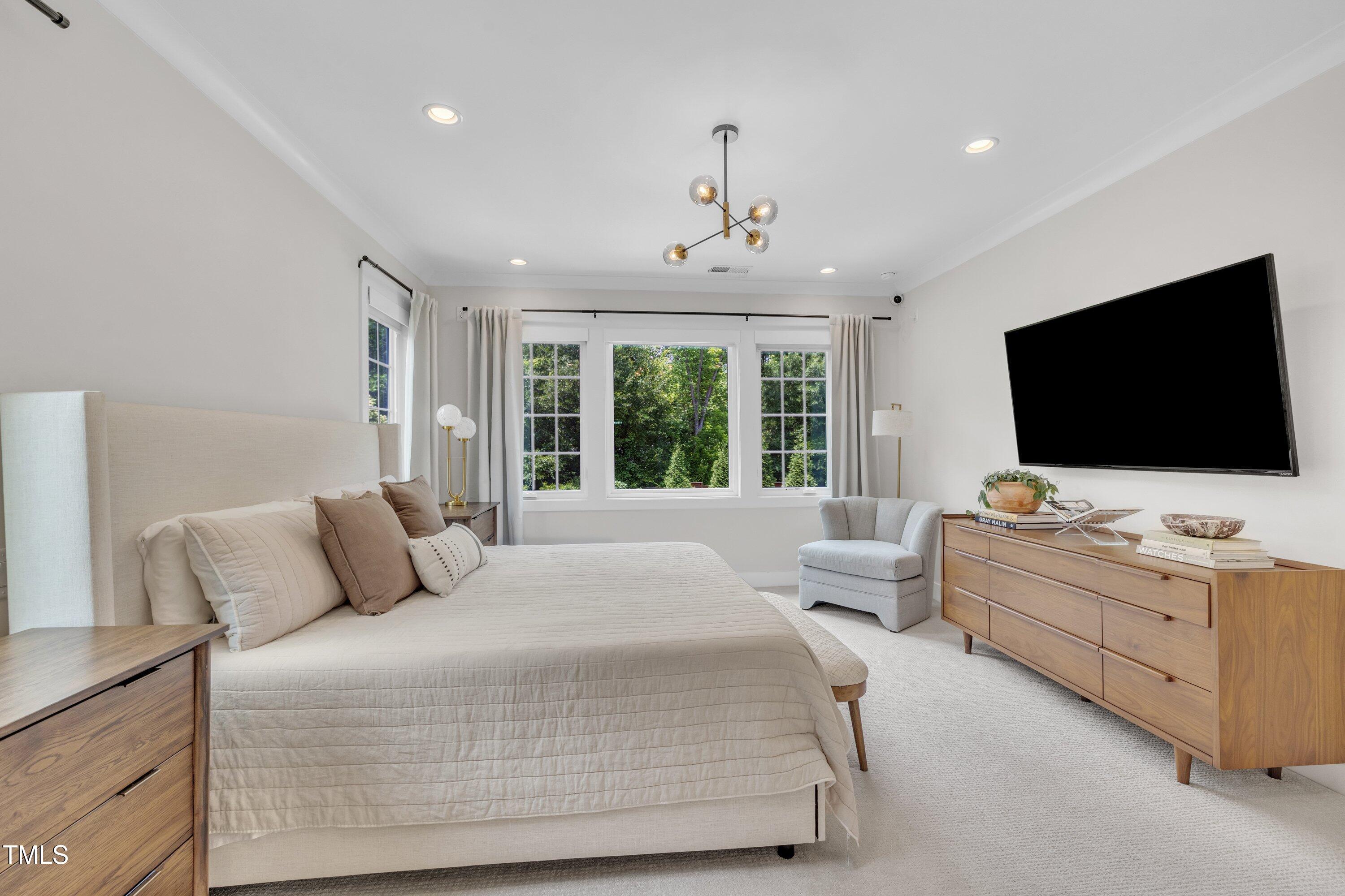 800 Wilcox Street Raleigh, NC 27607 - Photo 22 of 43 a bedroom with a flat screen television and a bed
