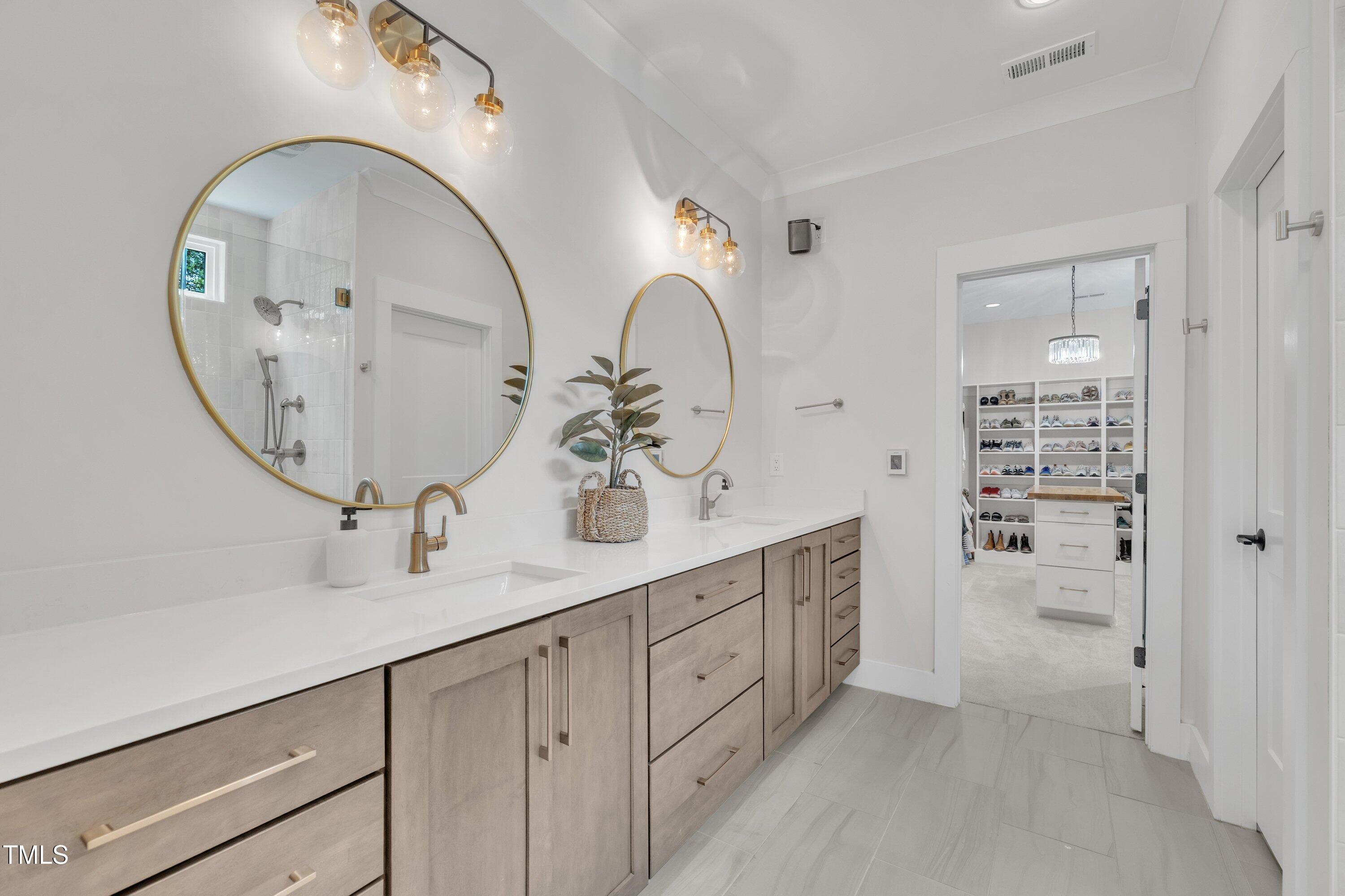 800 Wilcox Street Raleigh, NC 27607 - Photo 24 of 43 a spacious bathroom with a sink double vanity and a mirror