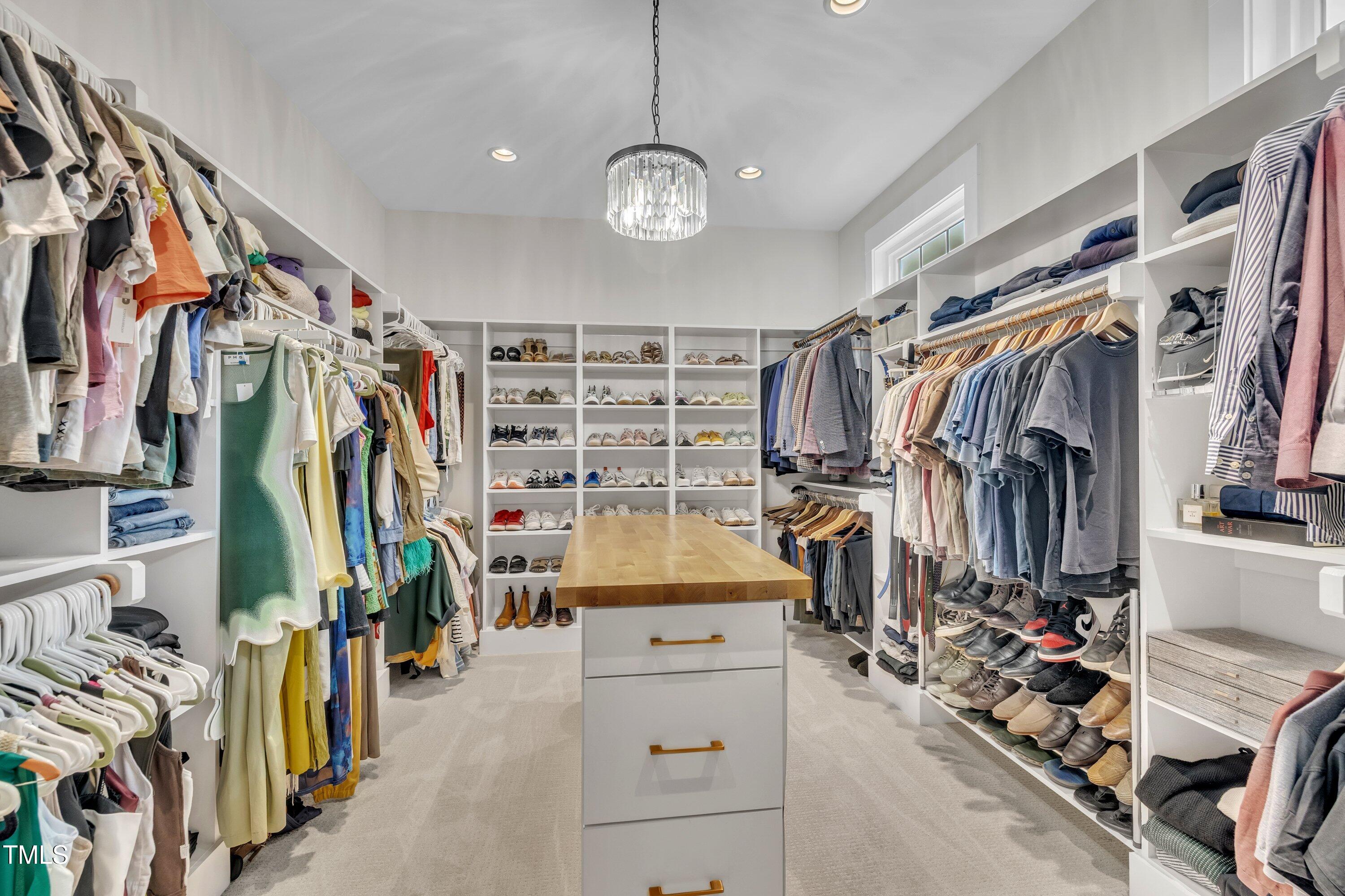 800 Wilcox Street Raleigh, NC 27607 - Photo 27 of 43 a view of walk in closet with clothes and shoes