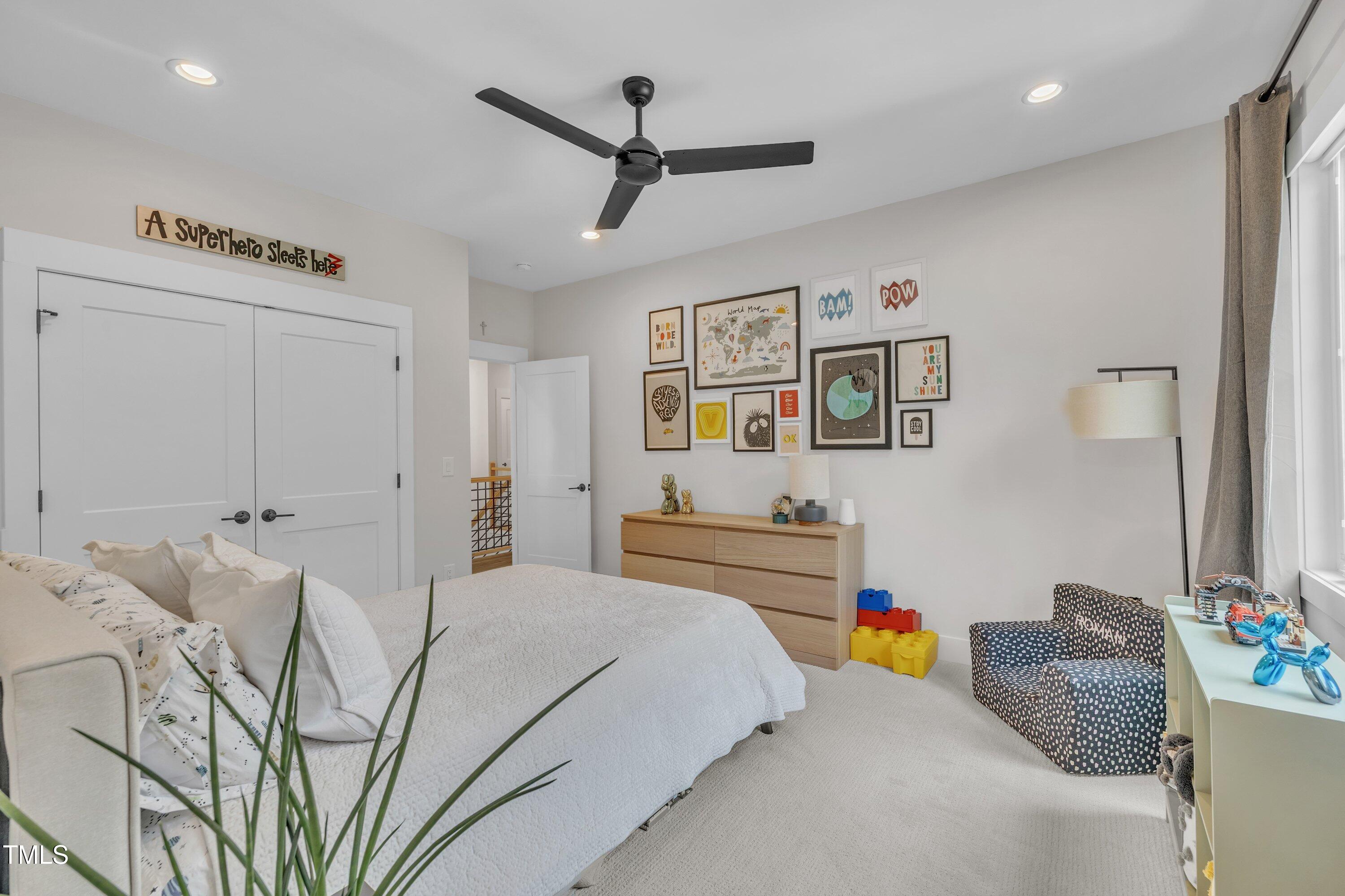800 Wilcox Street Raleigh, NC 27607 - Photo 29 of 43 a bedroom with furniture and a chandelier
