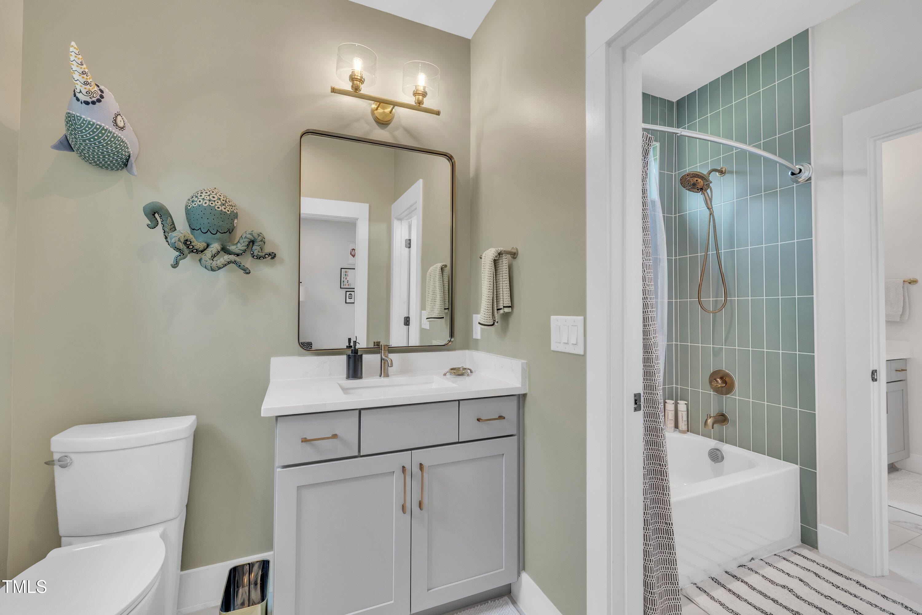 800 Wilcox Street Raleigh, NC 27607 - Photo 32 of 43 a bathroom with a sink a toilet and shower