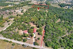 6630 Prather Road Springtown, TX 76082 - Photo 2 of 20 Expansive land parcel featuring multiple structures, mature trees, and direct road frontage