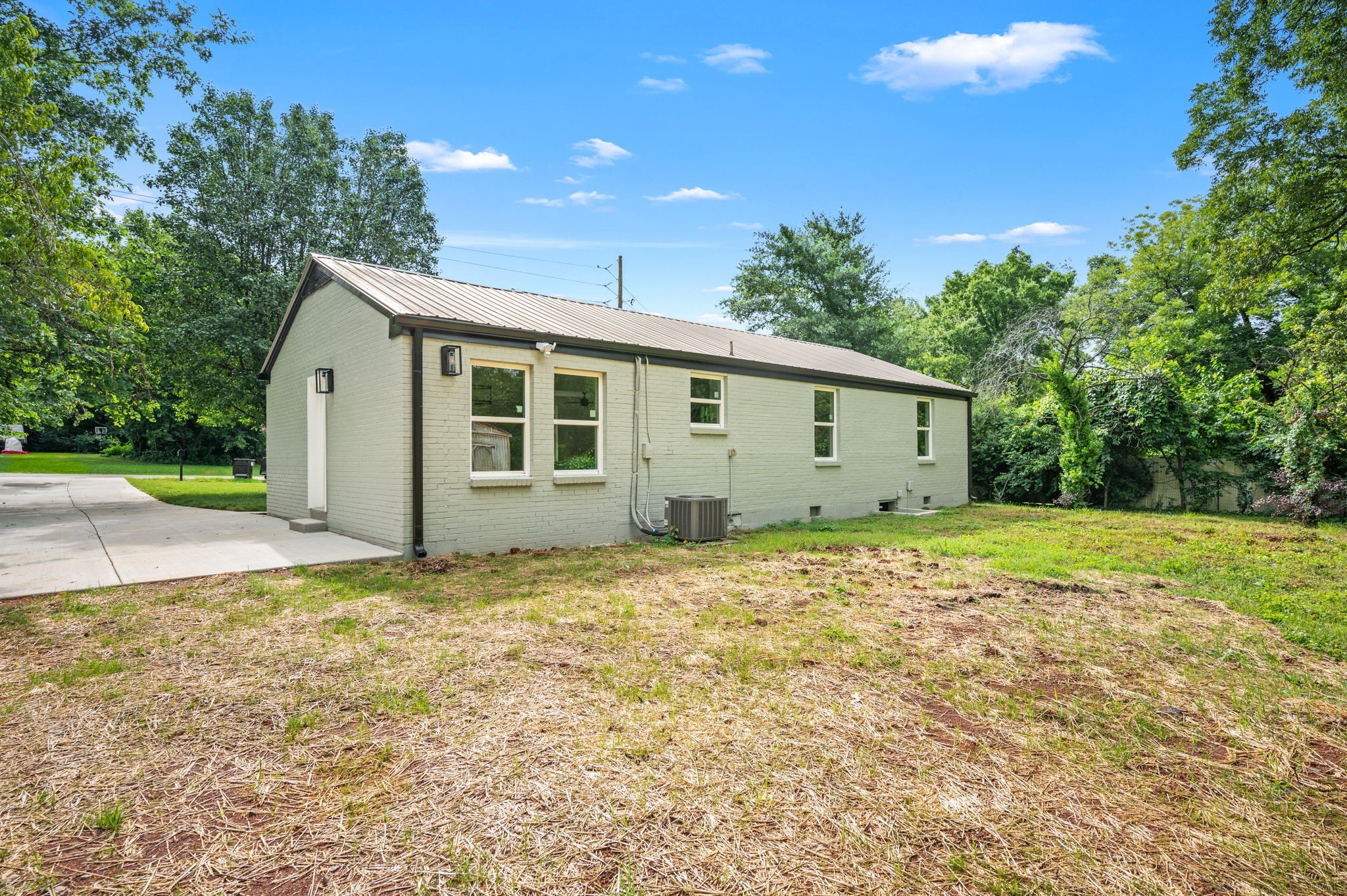 706 Mars Street Murfreesboro, TN 37130 - Photo 15 of 17 a view of a house with backyard and trees