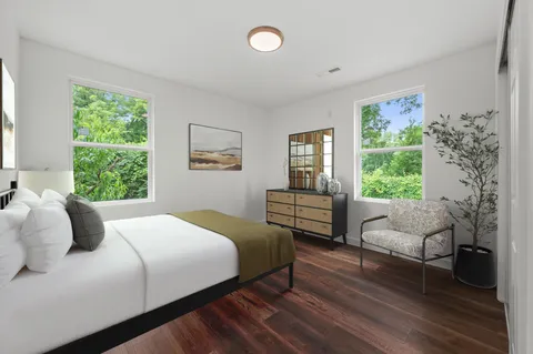 a bedroom with a bed and a couch